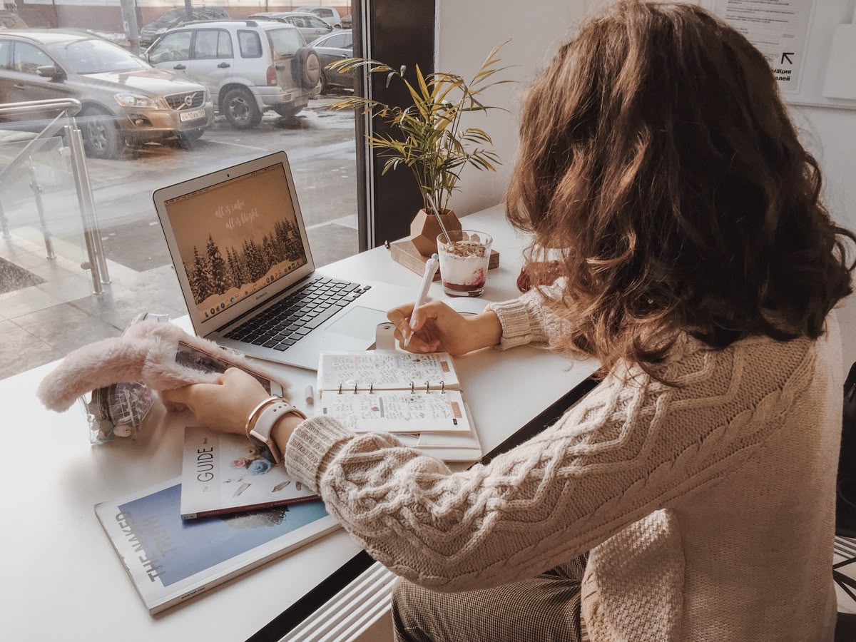 Person practising deep work at a laptop in a calm, organised workspace